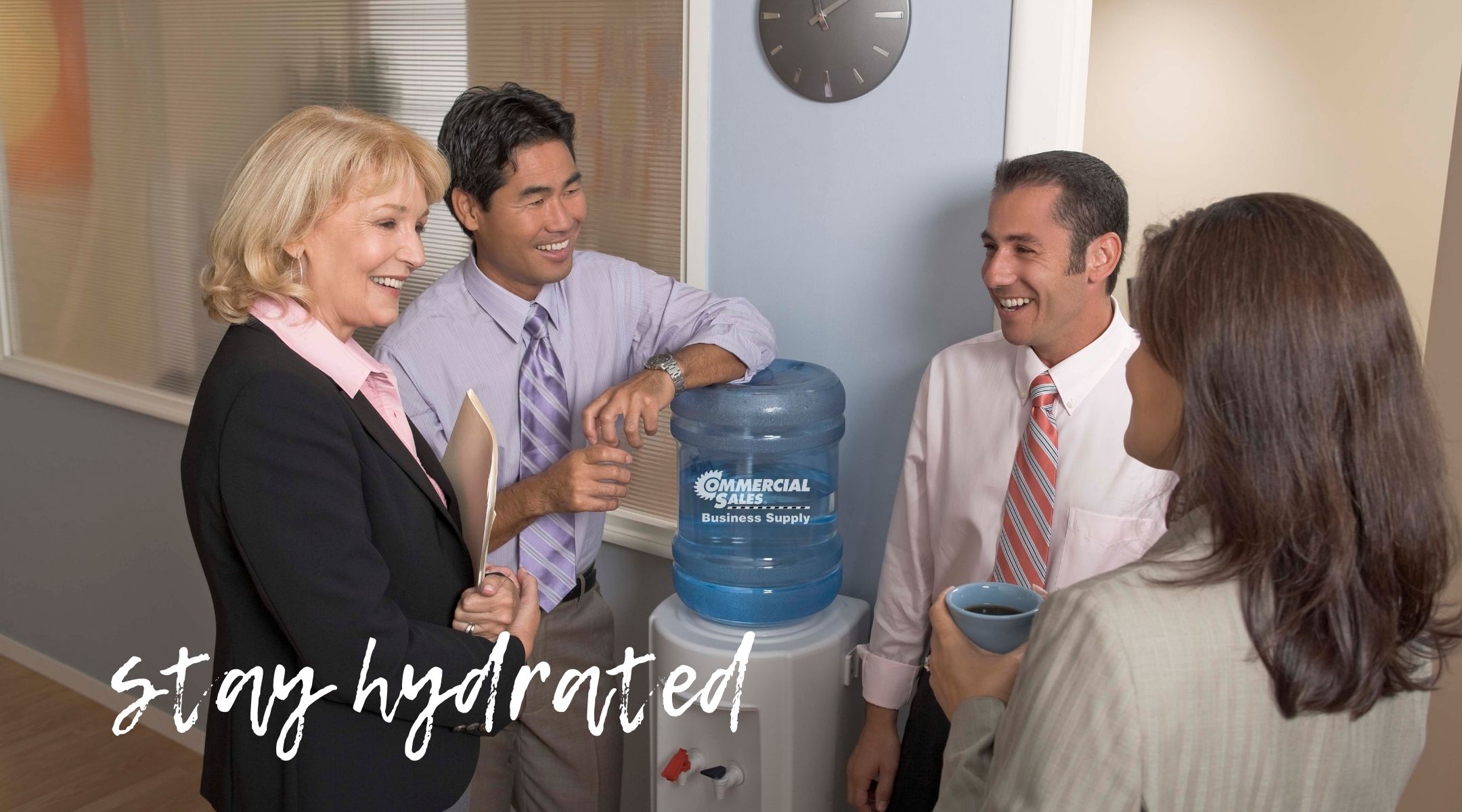 Group of diverse people at a Commercial Sales Business Supply water cooler